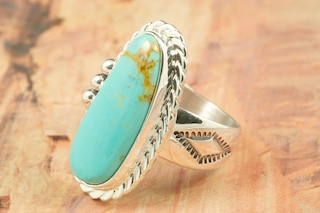 Genuine Manassa Turquoise set in Sterling Silver Ring. This Turquoise is also referred to as King�s Manassa Turquoise. The Manassa Turquoise mine is located in Manassa, Conejos County, Colorado. Created by Navajo Artist Tony Garcia. Signed by the artist.